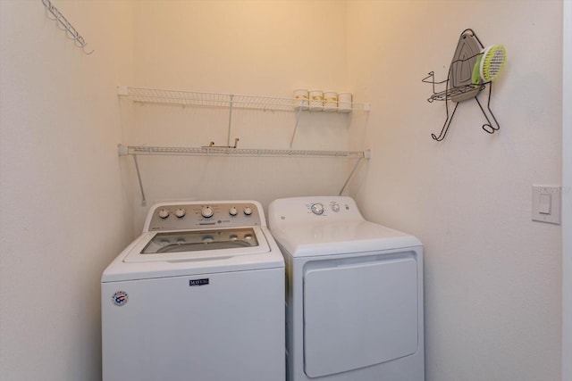 laundry room with separate washer and dryer