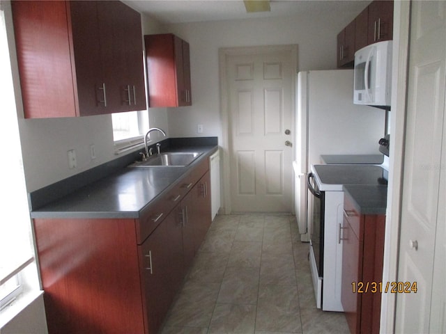 kitchen with sink and white appliances