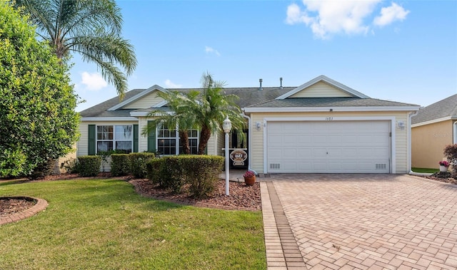 ranch-style house with a front lawn and a garage