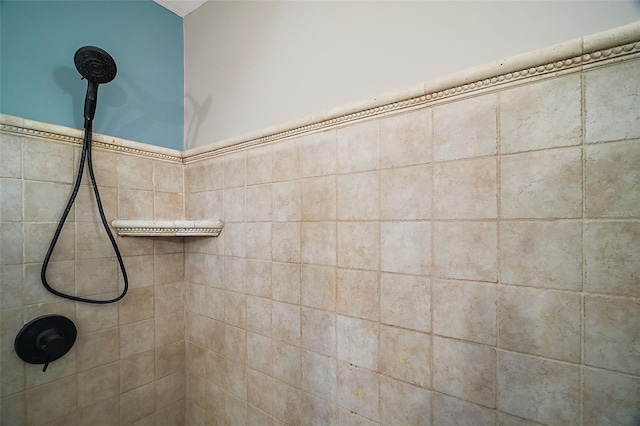 bathroom with a tile shower