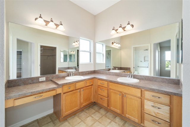 306 Bishopville Loop Unit 117, The Villages, FL 32162 - bathroom with double vanity, a wealth of natural light, and a sink