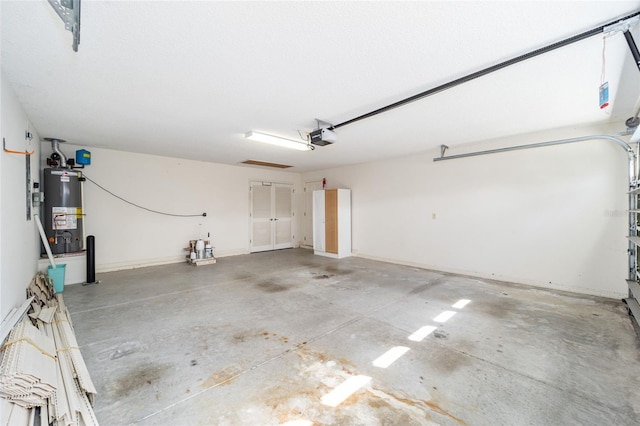 garage with a garage door opener and water heater