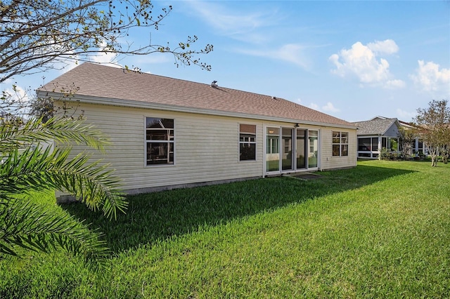 306 Bishopville Loop Unit 117, The Villages, FL 32162 - rear view of house with a yard