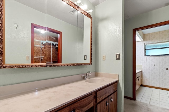 bathroom with tile patterned flooring and vanity