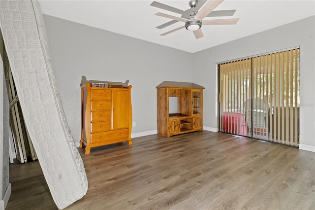 unfurnished bedroom featuring hardwood / wood-style flooring and ceiling fan