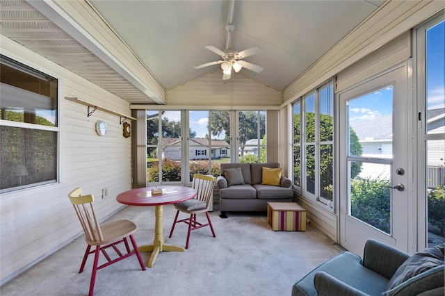 sunroom with vaulted ceiling, a healthy amount of sunlight, and ceiling fan