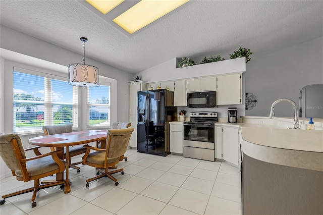 kitchen featuring a textured ceiling, vaulted ceiling, decorative light fixtures, black appliances, and white cabinetry