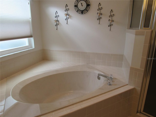 bathroom with a garden tub