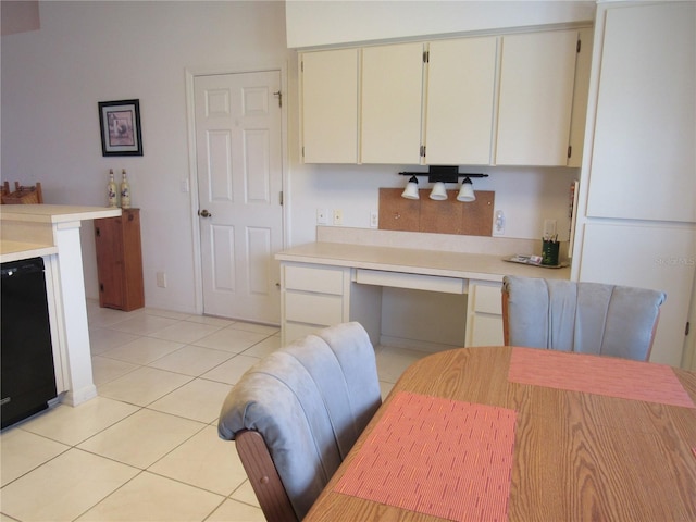 kitchen featuring dishwasher and light tile patterned flooring