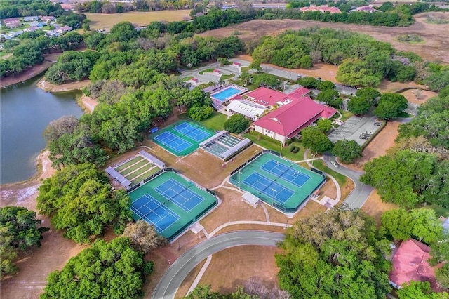 birds eye view of property with a water view