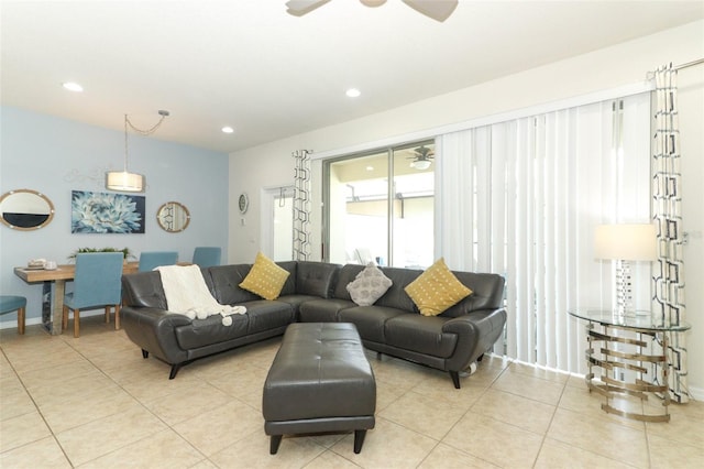 tiled living room featuring ceiling fan