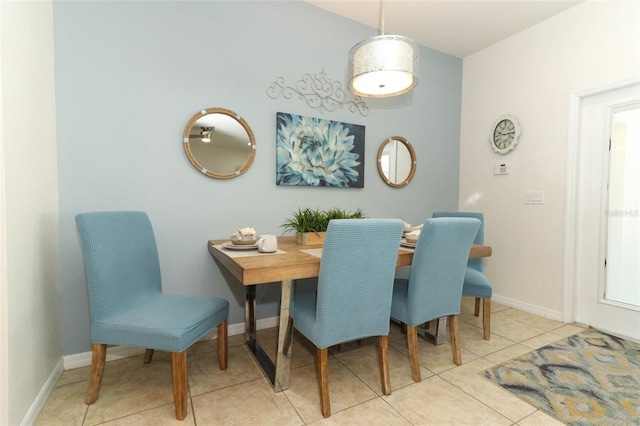 dining space featuring light tile patterned flooring