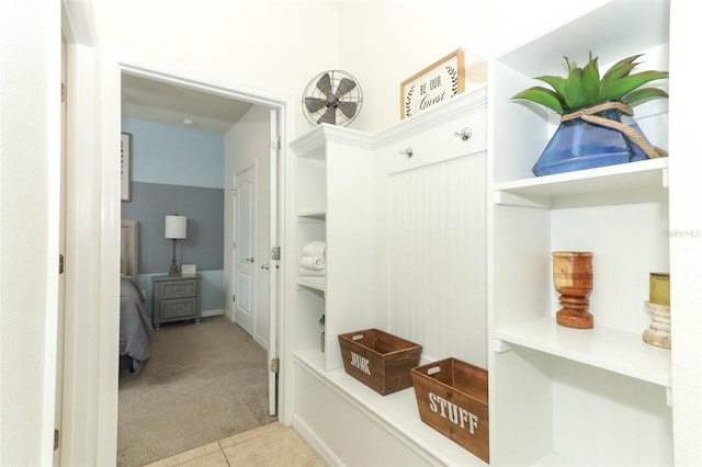 mudroom featuring light colored carpet