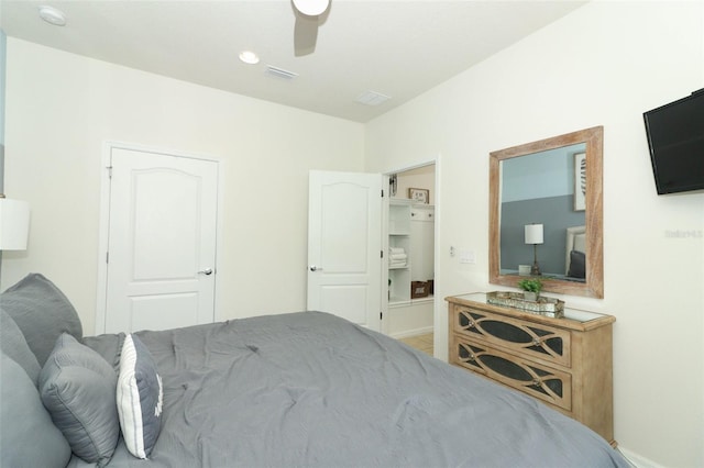 bedroom with ceiling fan and a closet