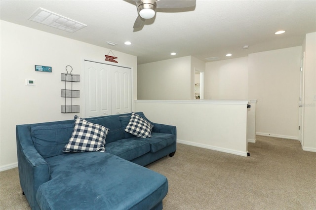 living room with ceiling fan and light carpet