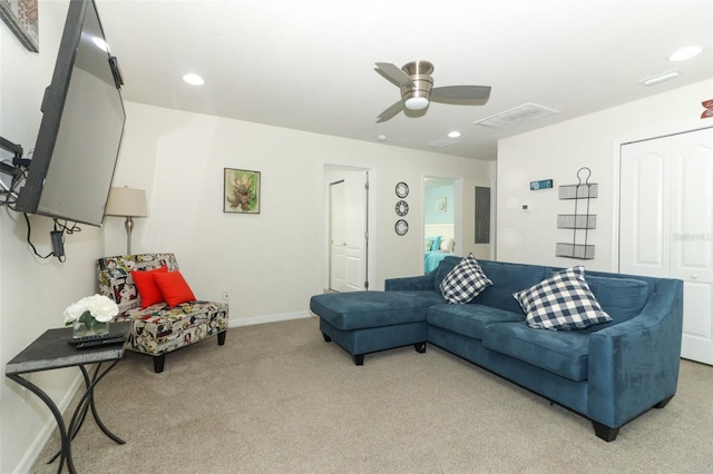 living room featuring ceiling fan and carpet floors