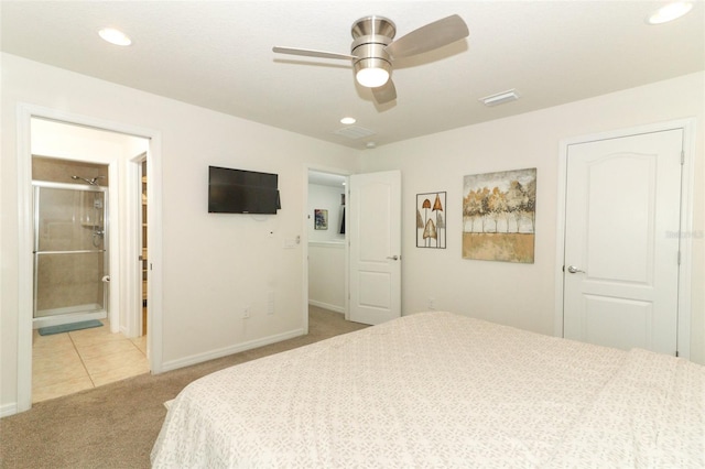 bedroom featuring ceiling fan, light carpet, and ensuite bath