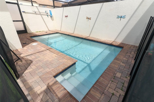 view of swimming pool featuring a patio