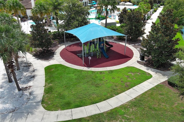 exterior space featuring a playground and a yard