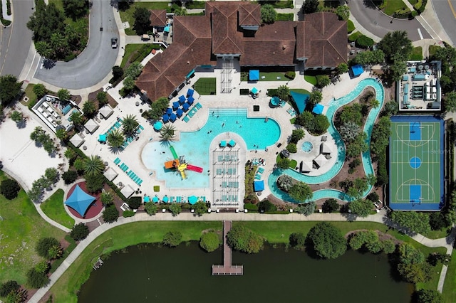 birds eye view of property with a water view