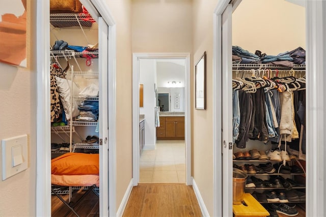 hallway with light hardwood / wood-style flooring