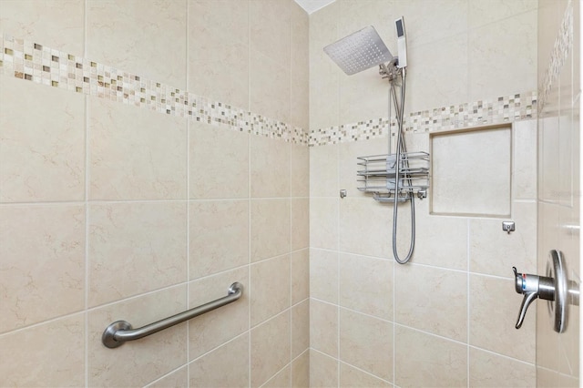 bathroom with tiled shower