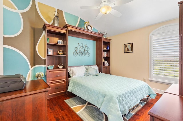 bedroom featuring lofted ceiling, ceiling fan, and dark hardwood / wood-style floors