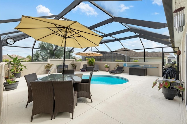 view of swimming pool with a patio and a lanai