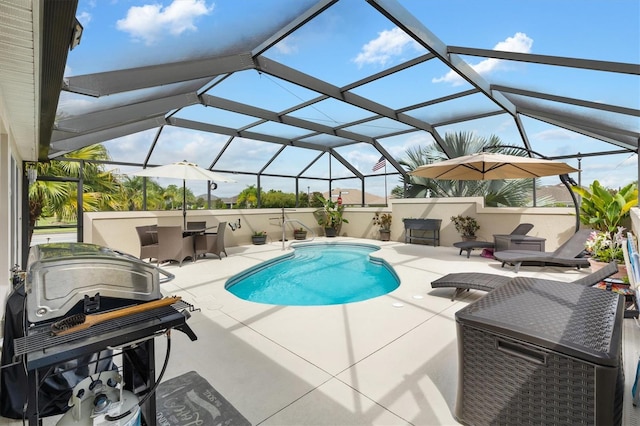 view of pool with a lanai, an outdoor bar, and a patio