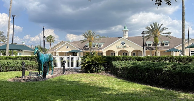 view of building exterior featuring fence