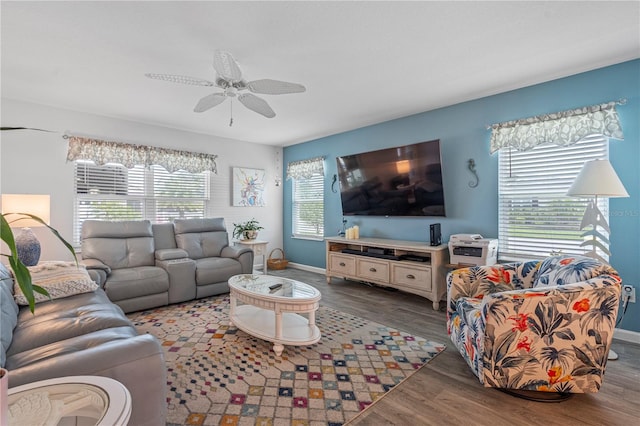 living room with hardwood / wood-style flooring and ceiling fan