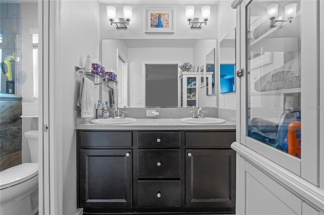 bathroom featuring vanity and toilet