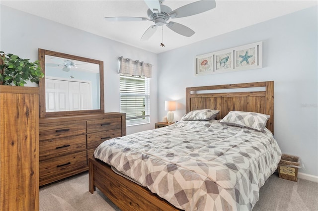 bedroom with ceiling fan and light carpet