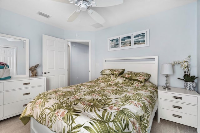 carpeted bedroom with a closet and ceiling fan