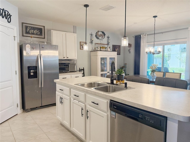 1771 Henin Cir, Tavares, FL 32778 - kitchen featuring white cabinets, visible vents, a chandelier, appliances with stainless steel finishes, and a sink
