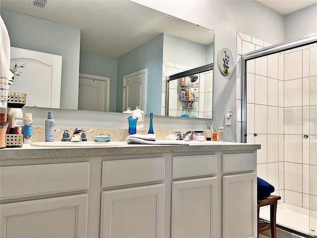 1771 Henin Cir, Tavares, FL 32778 - bathroom with double vanity, visible vents, a sink, and a shower stall
