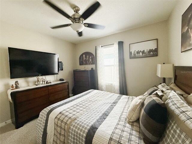 1771 Henin Cir, Tavares, FL 32778 - bedroom featuring light colored carpet, ceiling fan, and baseboards