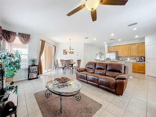 tiled living room featuring ceiling fan