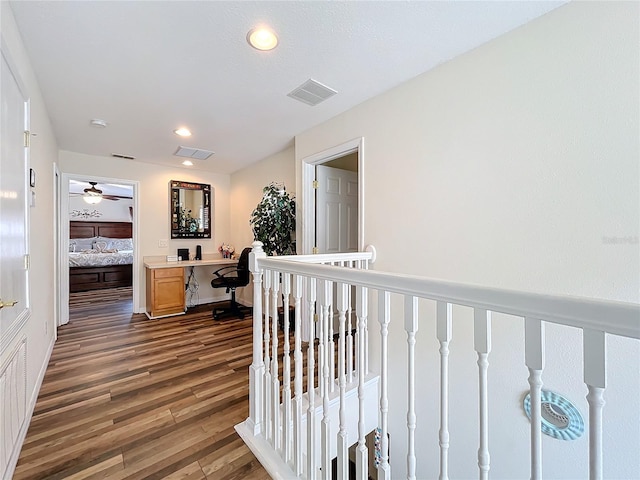 hall with dark wood-type flooring