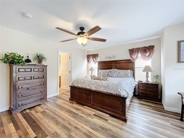 bedroom with ceiling fan and light hardwood / wood-style flooring