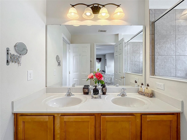 bathroom featuring vanity and a shower with door