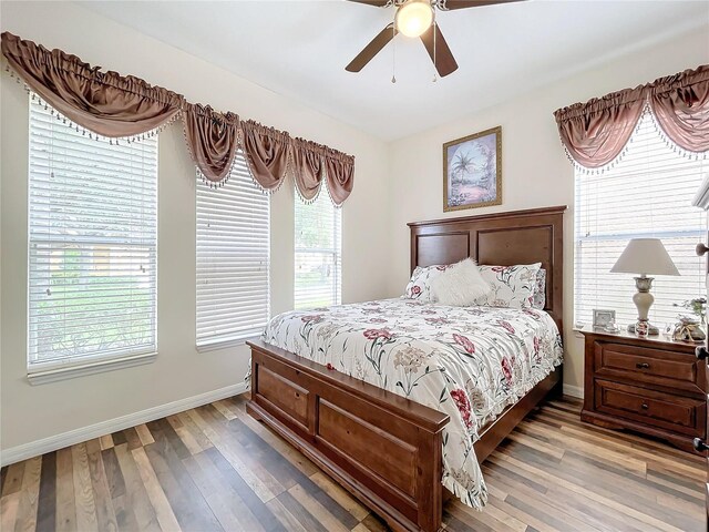 bedroom with hardwood / wood-style floors and ceiling fan