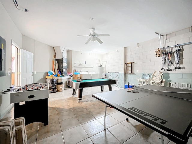 recreation room featuring pool table, light tile patterned flooring, and ceiling fan