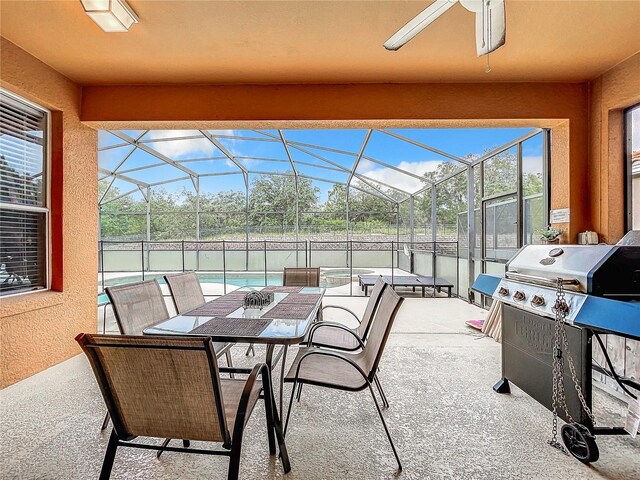 view of patio / terrace featuring a grill, a fenced in pool, ceiling fan, and a lanai