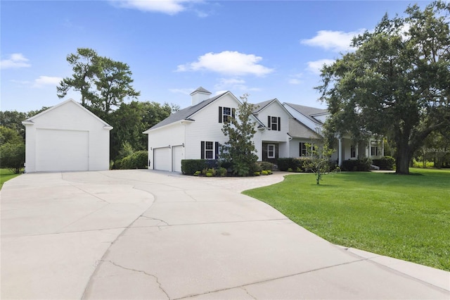 view of front of home featuring a front yard and a garage