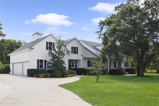 view of front of property featuring concrete driveway and a front yard