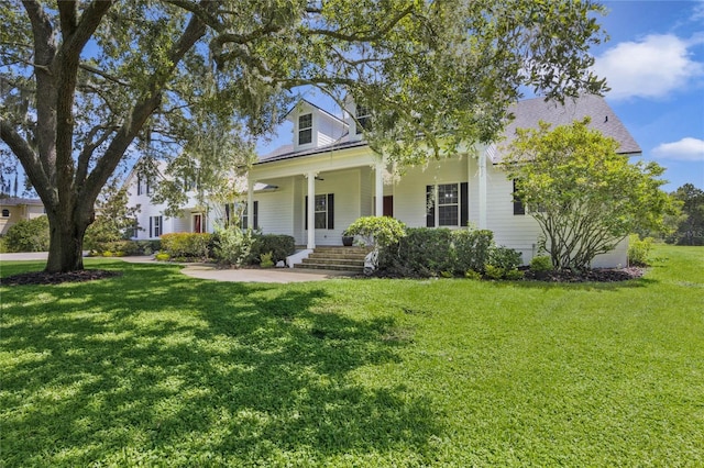 view of front of home featuring covered porch and a front lawn