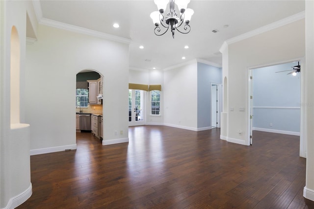 interior space with crown molding, dark wood finished floors, and baseboards