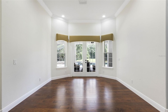 empty room with visible vents, baseboards, french doors, dark wood-style floors, and crown molding