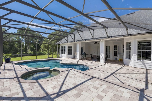 view of pool featuring a ceiling fan, a lanai, a patio area, and a pool with connected hot tub